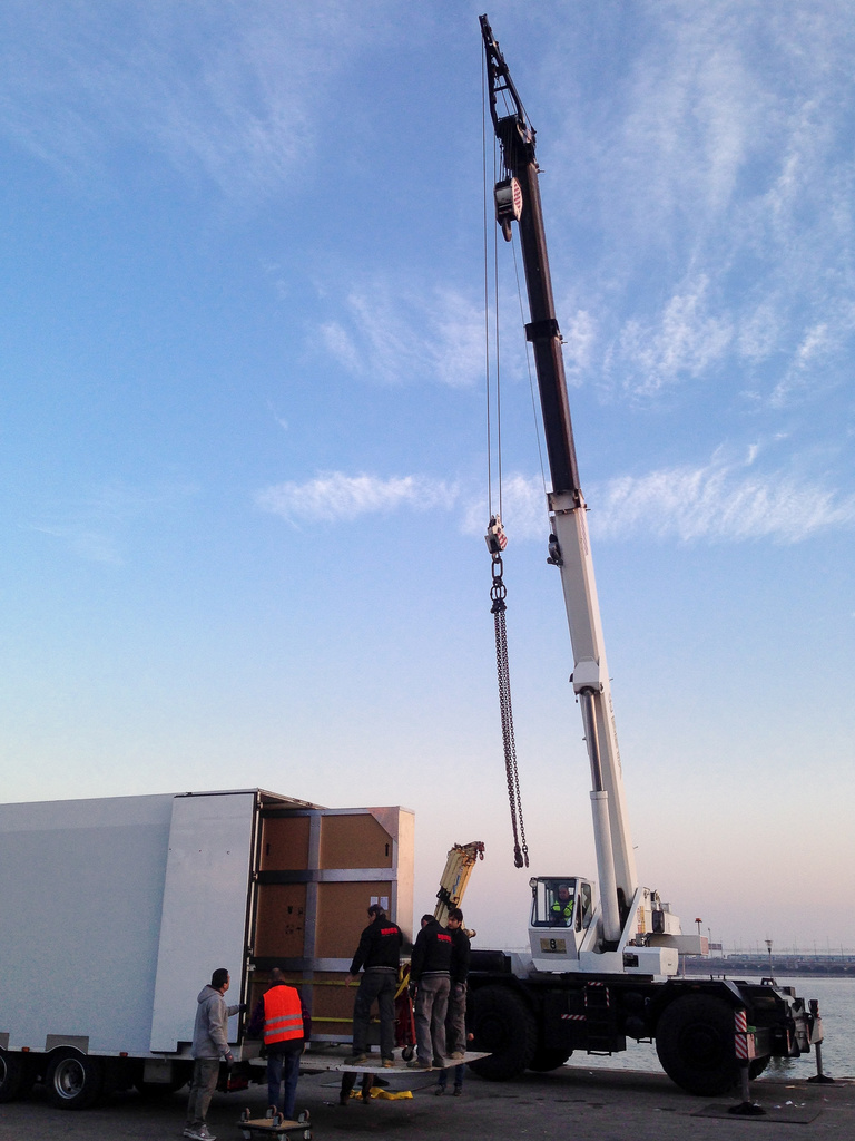 Crane preparing to hoist Mural onto boat