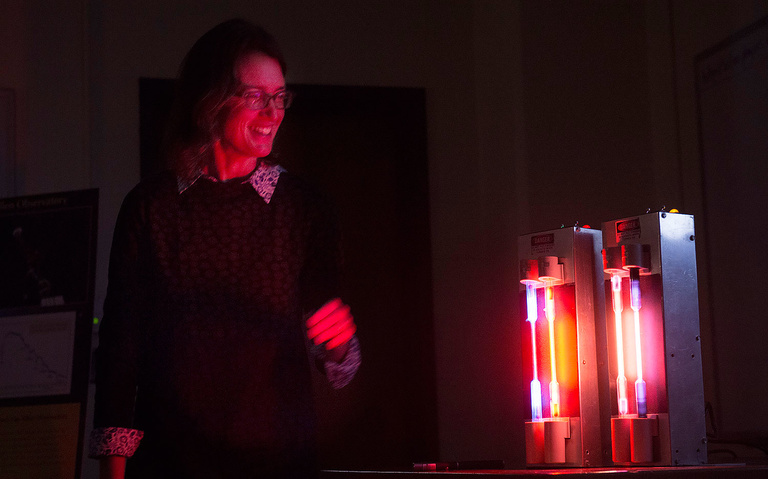 Cornelia C. Lang, Professor and Associate Professor in the Department of Physics & Astronomy, used 3D glasses to help visiting legislators see the unique light spectrum for various gases, including hydrogen and neon. 