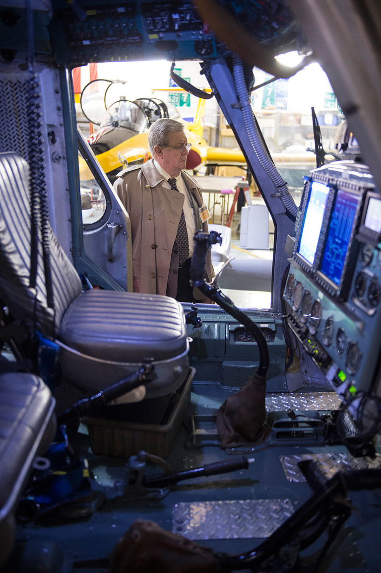 Iowa State Rep. Dave Heaton looks inside a Polish-manufactured Mi2 helicopter acquired by the University of Iowa and upgraded for research. 