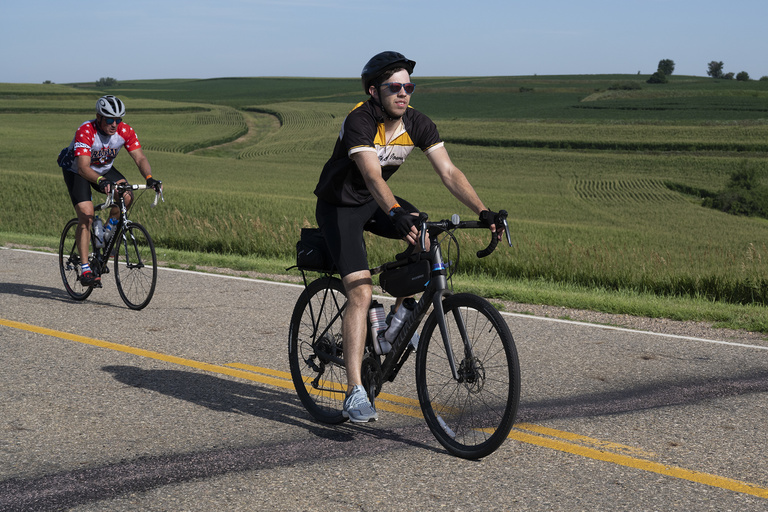 A RAGBRAI rider wearing a University of Iowa jersey makes their way along the 53-mile route from Sergeant Bluff to Ida Grove on Sunday, July 24.