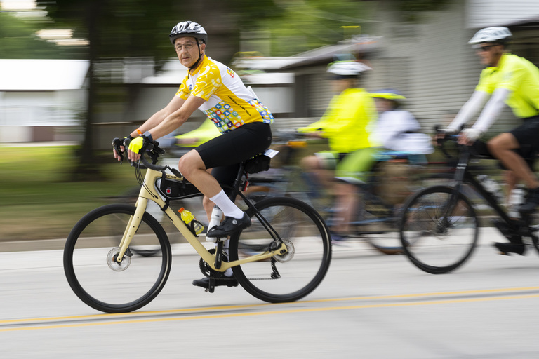A member of the UI Stead Family Children’s Hospital RAGBRAI team makes their way into a pass-through town.
