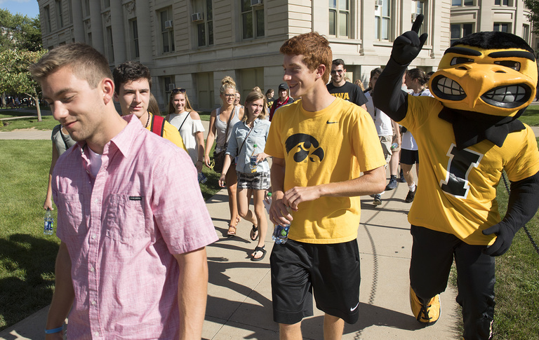 Students walk to president's block party.