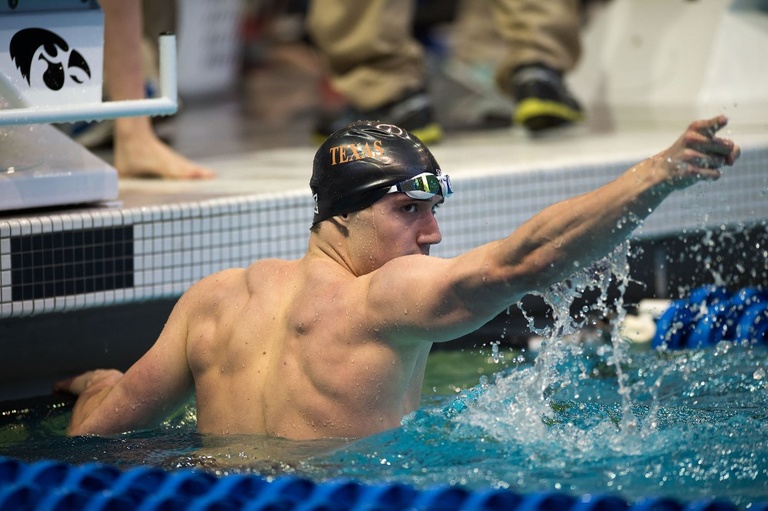 A swimmer celebrates his swim