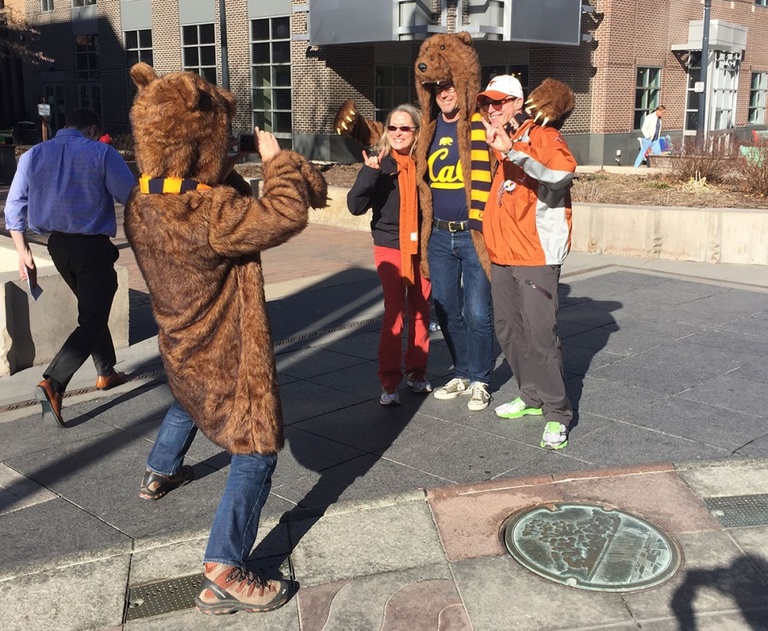 Texas fans take a picture with the Cal Bear on the Pedestrian Mall.