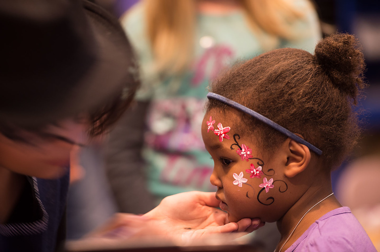 a child has her face painted