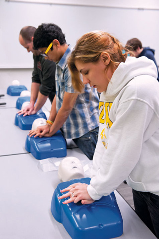 Students participate in hands-on CPR training