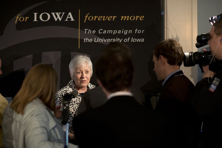 UI President Sally Mason being interviewed by reporters after the campaign announcement. 