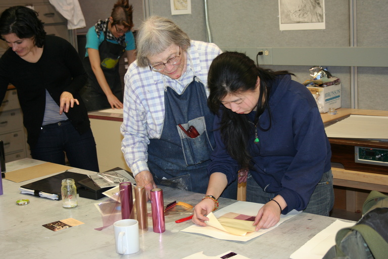 Virginia A. Meyers works with a young artist. Photo by Deanne Warnholtz Wortman.