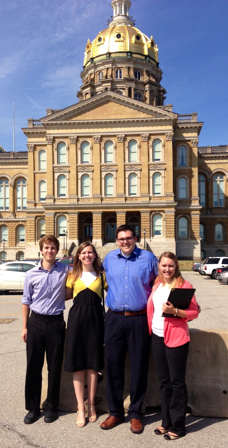 University of Iowa graduate students standing in front of the Iowa State Capitol