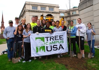 Students with UI mascot Herky and a Tree Campus USA banner