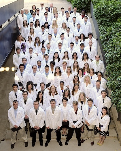 Dental students in white lab coats.