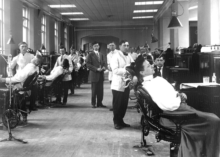 Students in a dental clinic circa 1910.