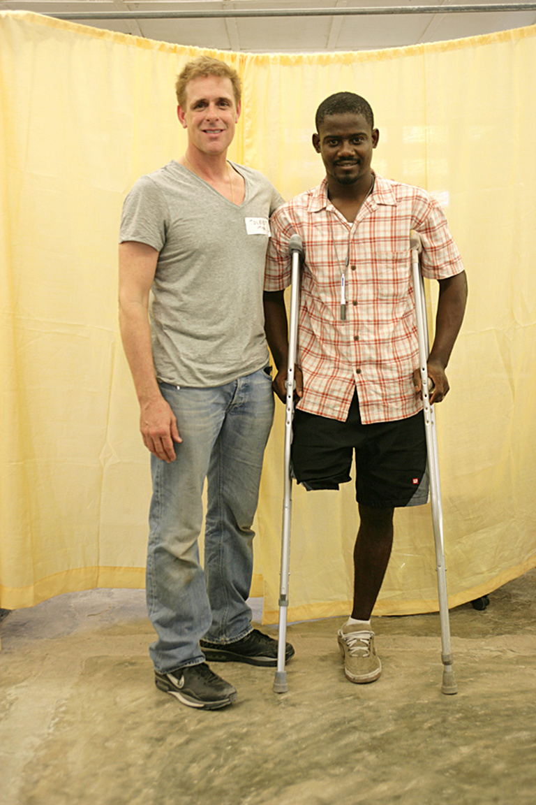 david colbert with patient in haiti