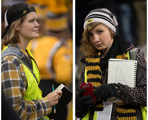 two school of art students sketching at football game