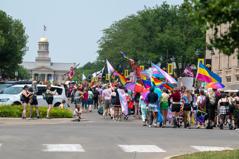 The Iowa City Pride Parade makes its way down Iowa Avenue toward the Old Capitol on Saturday, June 17, 2023.