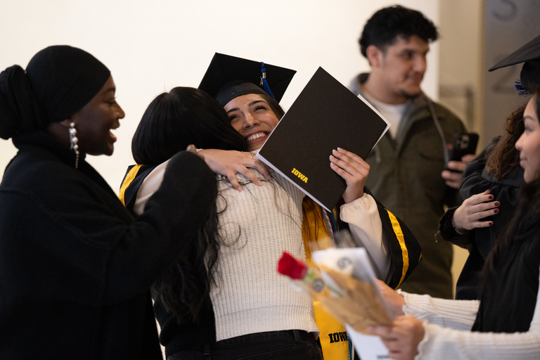 A graduate receives a hug