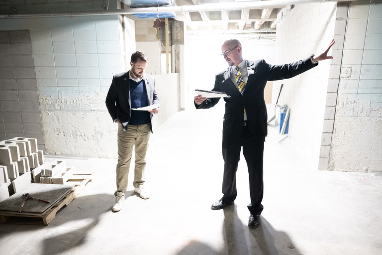 David Miles, lead TRACERS investigator and associate professor in physics, shows Joseph Westlake, director of the heliophysics division at NASA, the seventh floor of Van Allen Hall