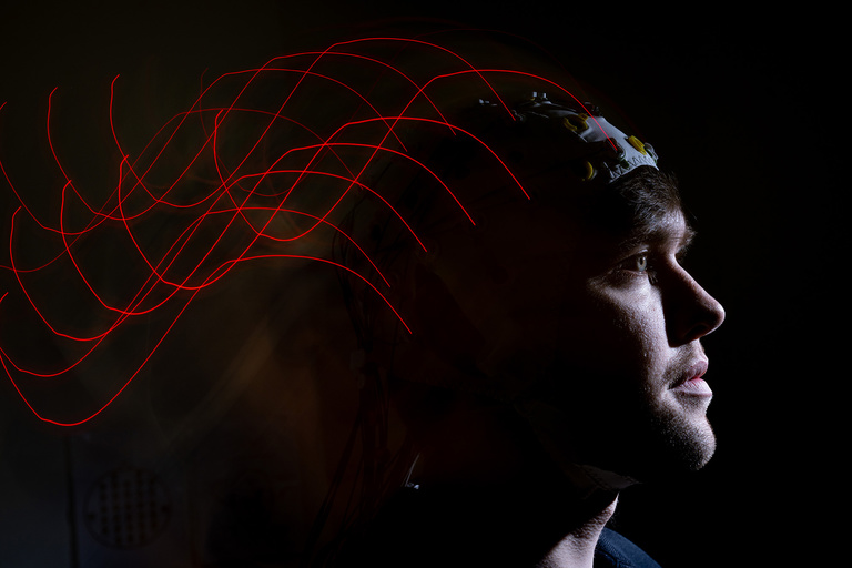 A photo illustration of an electroencephalography (EEG) cap