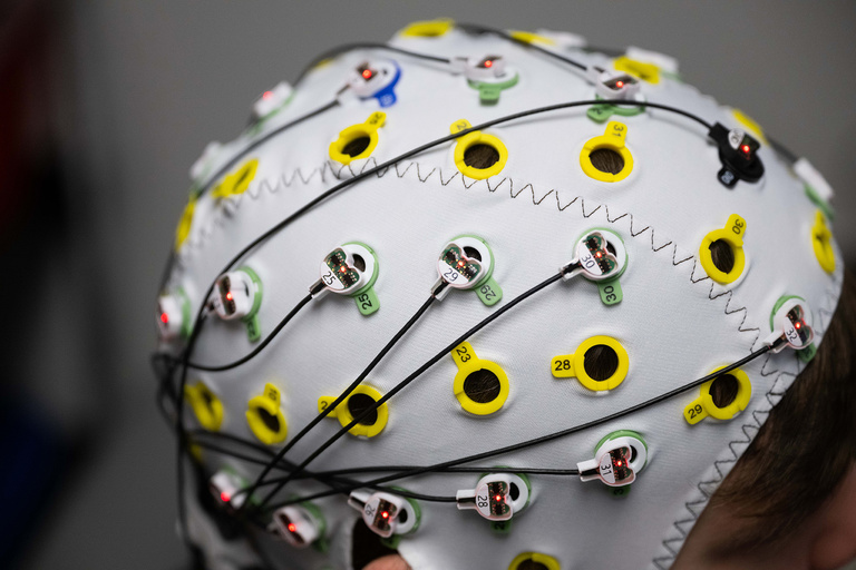 A close-up of an electroencephalography (EEG) cap, or brain cap, a device that monitors electrical activity in the brain by using sensors attached to the scalp. The cap measures which brain waves are activated when participants take part in a series of activities. The activities form the basis for a study that aims to understand whether and how adolescents may be predisposed to alcohol use later in life.