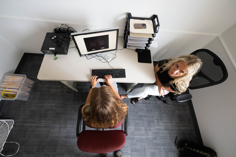 Hayley Chappell (left) and Megan Hilliard in the testing room that will be used for a study to better understand the relationship between cognitive skills associated with self-regulation and a physically active lifestyle. The research is led by Michelle Voss, associate professor and Ronnie Ketchel Faculty Fellow in the Department of Psychological and Brain Sciences, and is one of four studies taking place in a new research hub in Cedar Rapids, Iowa.