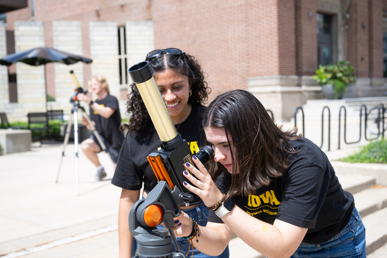 Students looking through a telescope