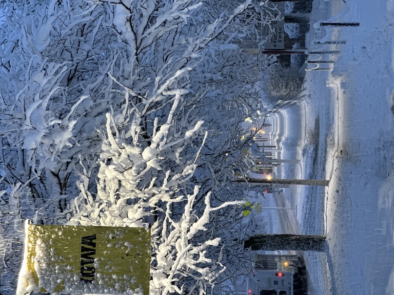 Campus sidewalk covered in snow
