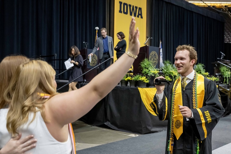 Graduates take photos of each other