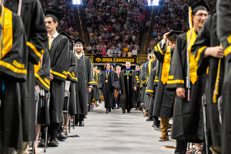 CLAS Dean Sara Sanders and Provost Kregel walk down the aisle