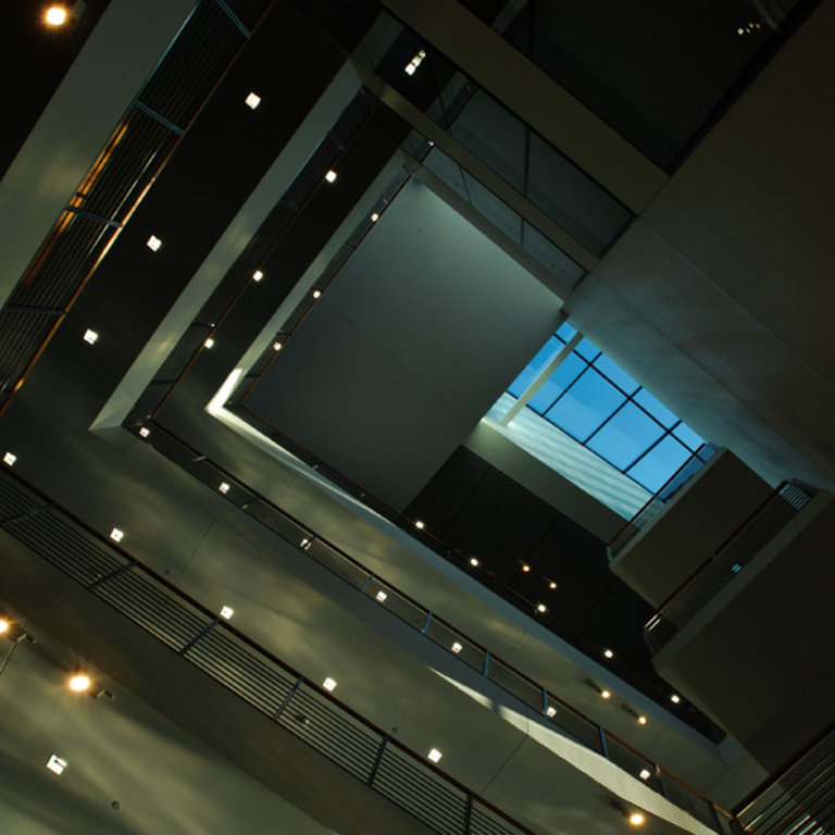 Blue sky is seen looking straight up through a skylight.