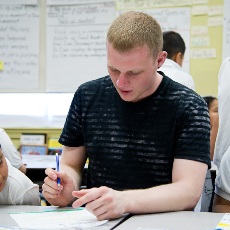 Josh Franz helps the students with their art exercises. Franz was in high demand; many of the students sought his assistance.