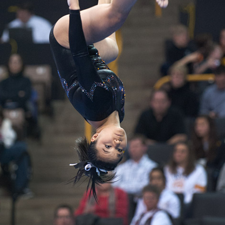 Iowa gymnast competing on the beam.