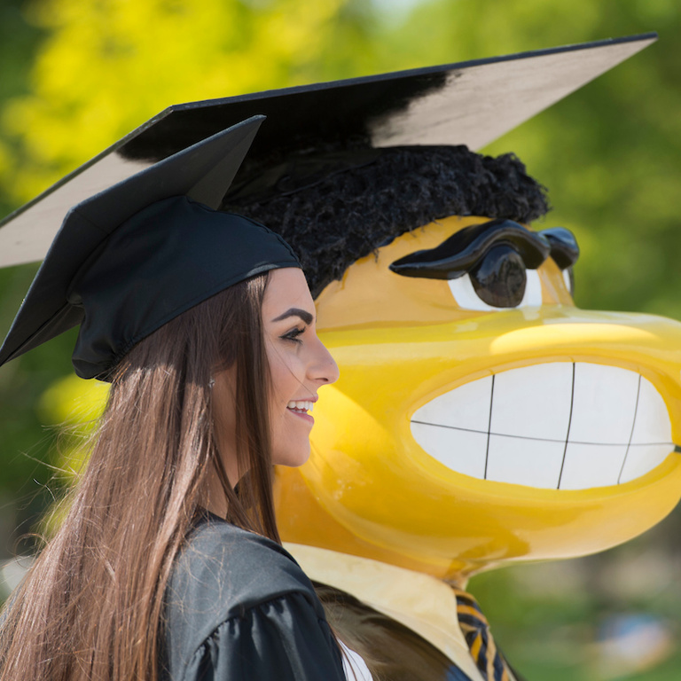 young woman with graduation herky