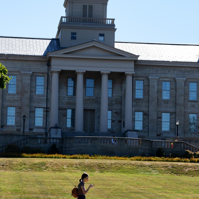 new student in front of old capitol