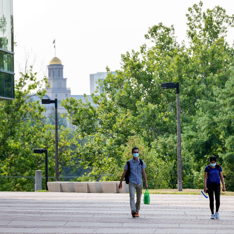hawkeyes walk with old cap in background