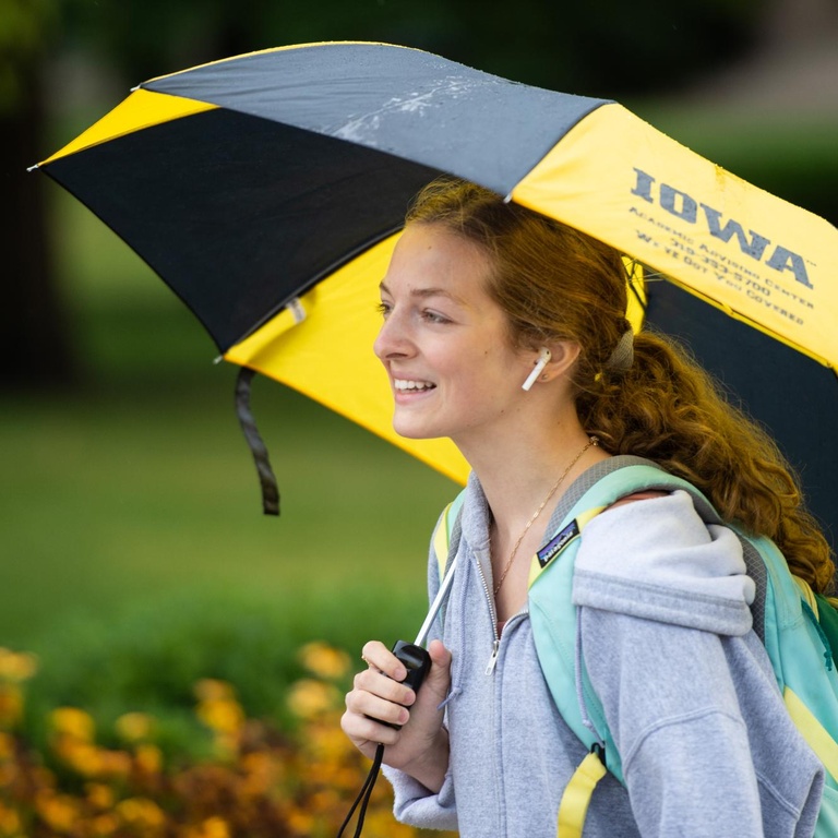 student with umbrella