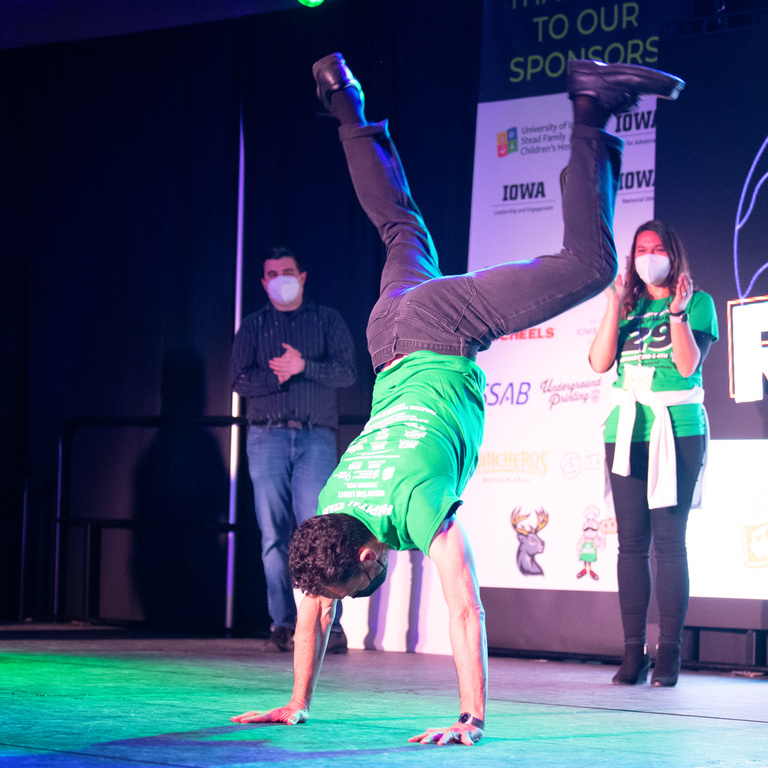 Dr. Alexander Bassuk, physician-in-chief and chair of pediatrics at UI Stead Family Children’s Hospital, does a cartwheel on a challenge for a donation.