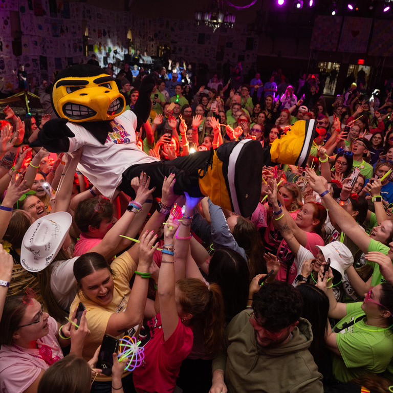 Herky crowdsurfs during Dance Marathon 29.