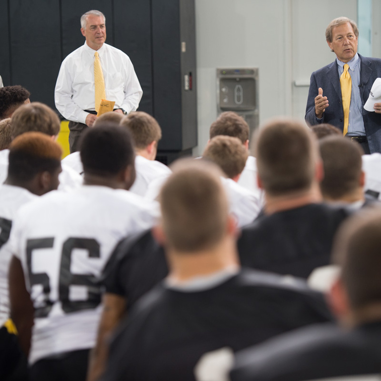 Bruce Harreld speaks to the football team