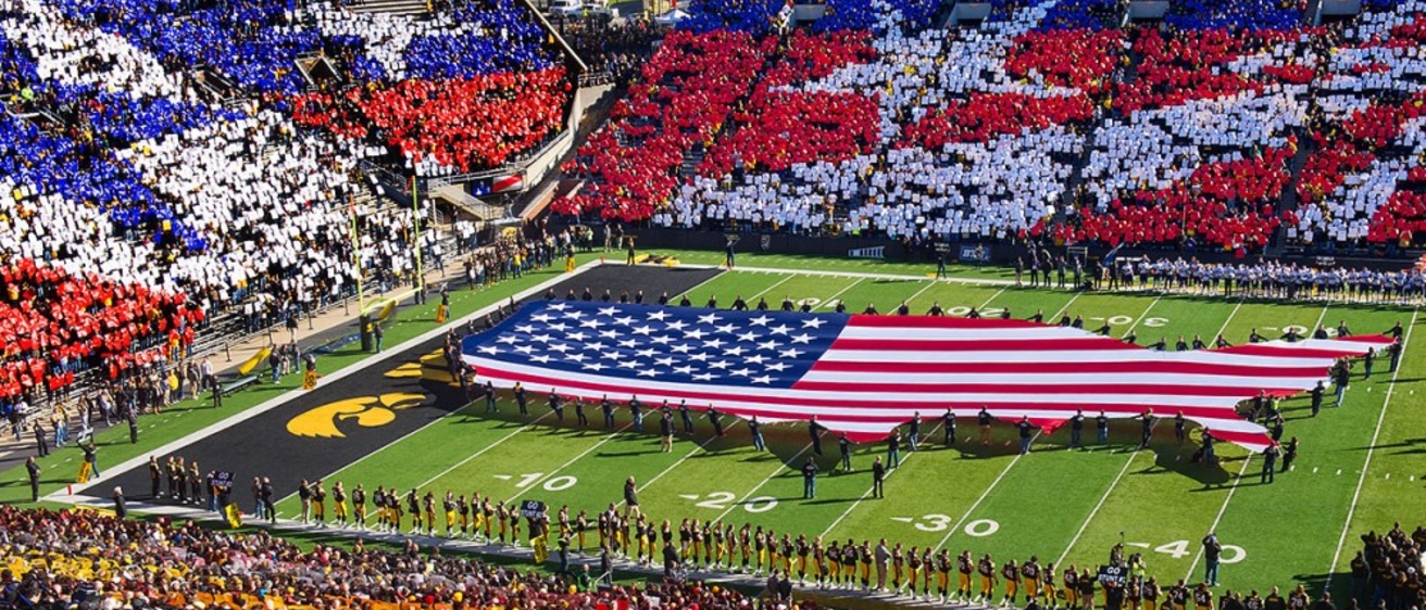 American flag on the field during card stunt