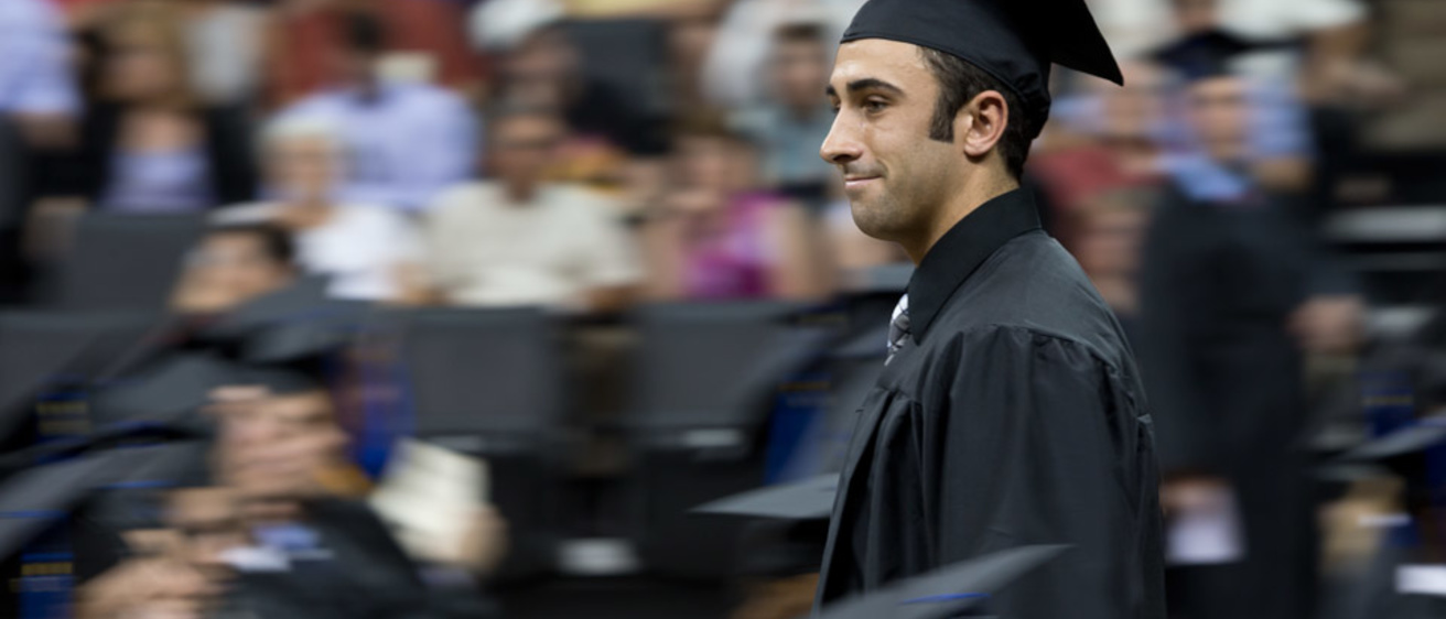 A graduate at Tippie College of Business commencement