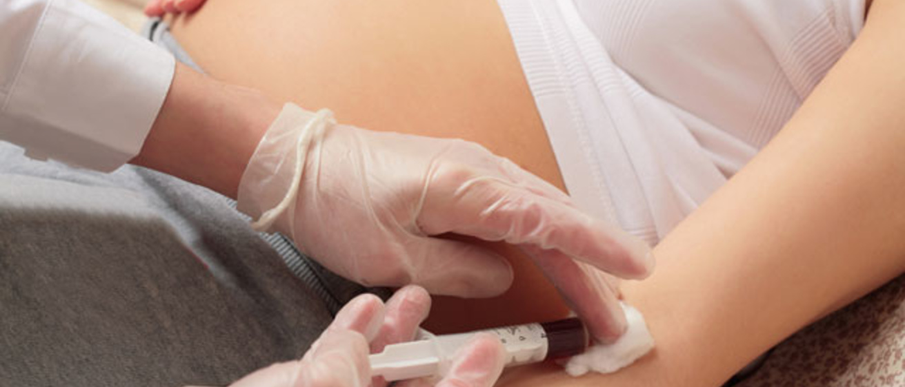 blood being drawn from a pregnant woman's arm