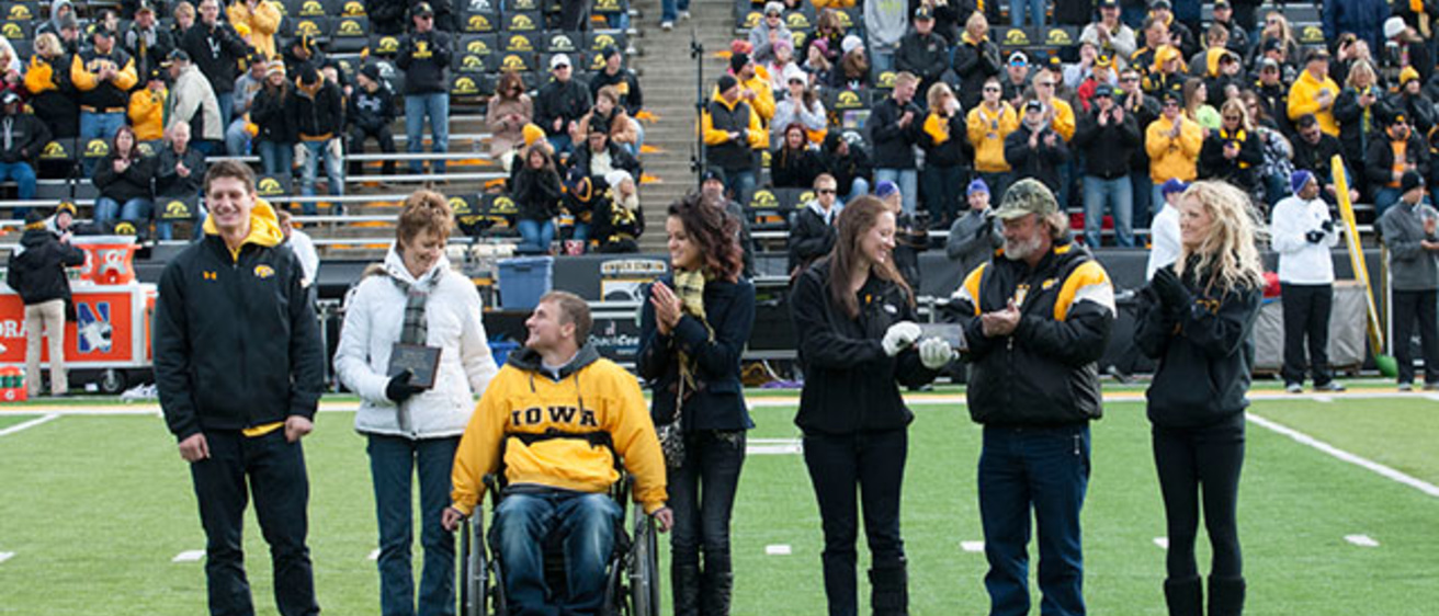 Mom and Dad of the Year presentation at Kinnick Stadium