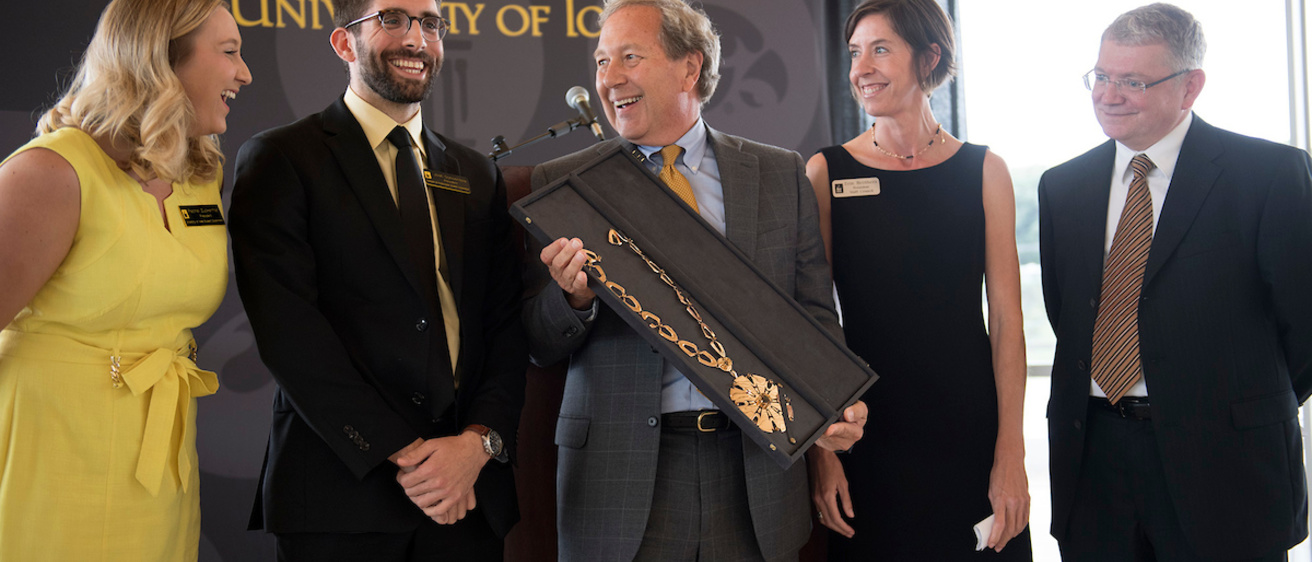 President Bruce Harreld receives the UI Presidential Medallion