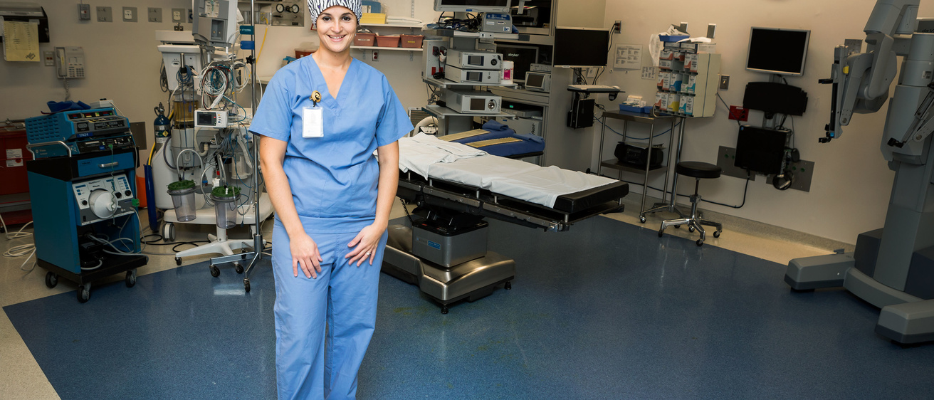 portrait of Jennier Ortega in an operating room wearing blu scrubs