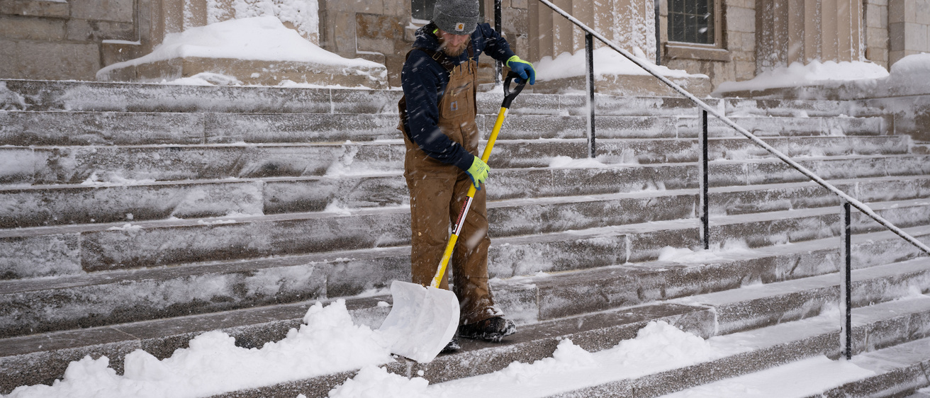 Photo of man shoveling snow