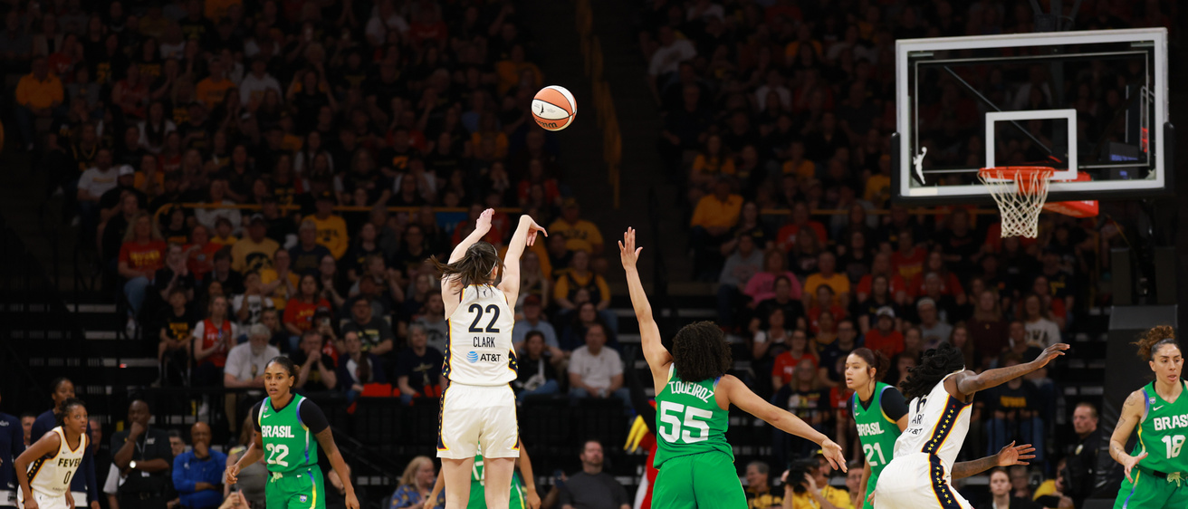 Caitlin Clark shoots from the logo