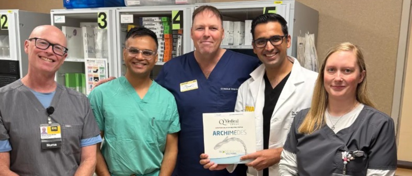 Five members of the team who performed the nation's first ARCHIMEDES procedure. One person is holding a box that says ARCHEMEDES, the name of the device.