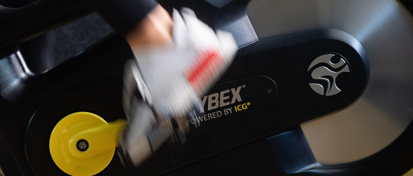 a detail shot of someone pedaling during a spin class