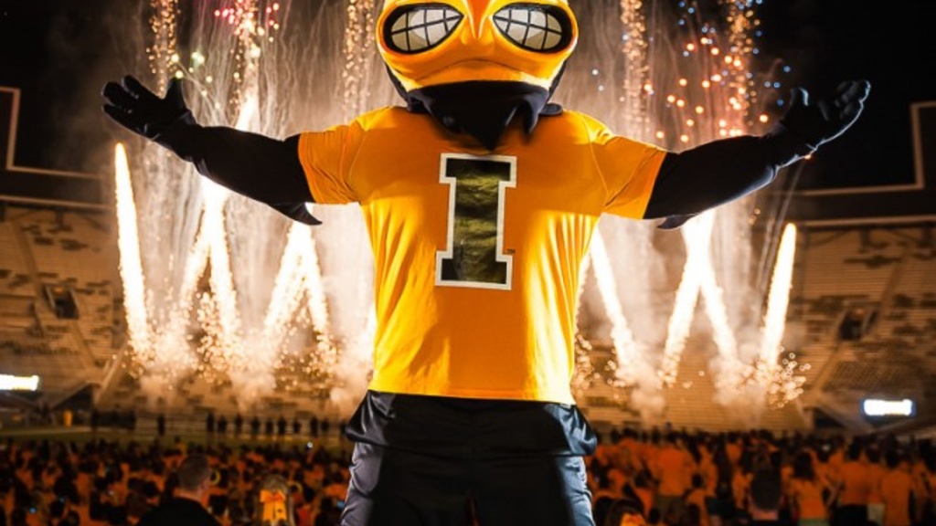 Mascot Herky with fireworks in the background.
