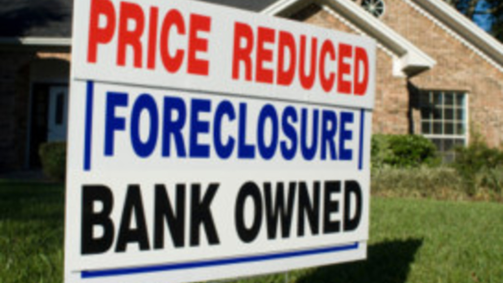Photo of Price Reduced, Foreclosure, Bank Own sign in front of brick house